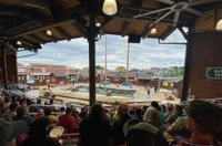sitting in Climate-Controlled Grandstand watching Paula Deen's Lumberjack Feud Supper Show in Pigeon Forge TN