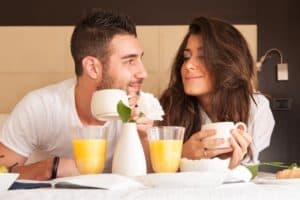 Couple enjoying breakfast in a hotel room in Pigeon Forge