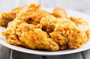 Plate of golden southern fried chicken