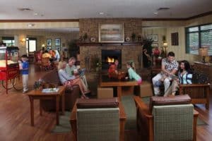 A family relaxing in the lobby at our Great Smoky Mountain hotel.