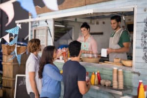 people getting food from a food truck