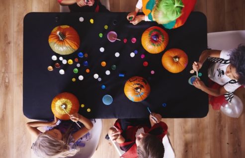kids painting pumpkins