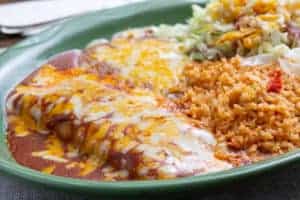 plate with enchiladas and mexican rice