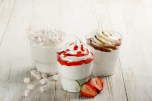 ice cream sundaes with chocolate and strawberries