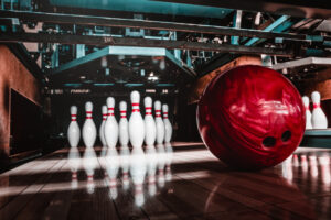 a bowling ball headed to pins