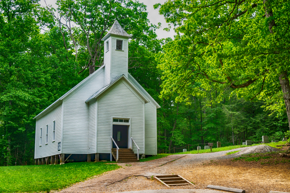 directly in front of little white church called Primitive Baptist Church in Cades Cove